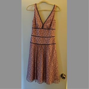 Pink dress with black lace overlay